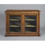 A VICTORIAN BURR WALNUT AND PARCEL GILT SIDE CABINET, the moulded edged top over panelled frieze