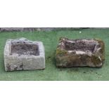 A SMALL SANDSTONE TROUGH of rough hewn oblong form, 23 1/2" x 14 1/2" x 7 1/2", together with