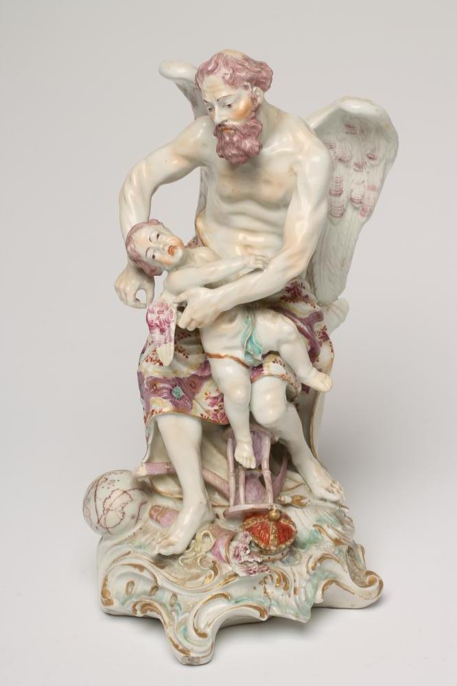 A DERBY PORCELAIN FIGURE, c.1770, modelled as Father Time clipping the Wings of Love, raised upon