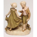 AN ART NOUVEAU ROYAL DUX BISQUE PORCELAIN FIGURAL VASE, modelled as two children standing beside