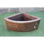 A SALTGLAZE STONEWARE QUADRANT TROUGH with moulded rim and applied with a metal ring, 25" x 13 1/