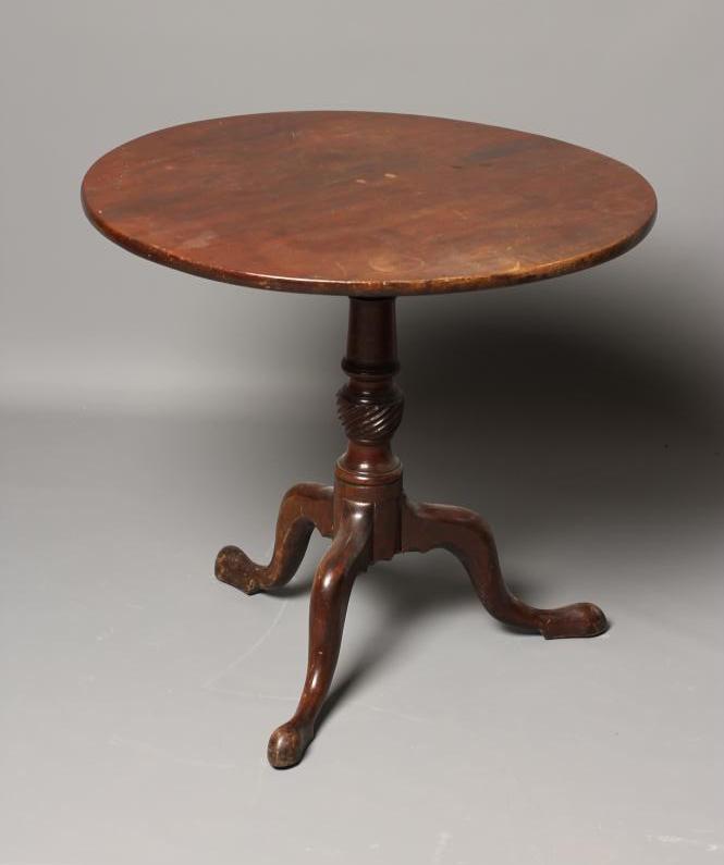 A GEORGIAN MAHOGANY TRIPOD TABLE, late 18th century, the circular tip up top on a ring and wrythen