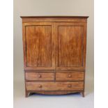 A GEORGIAN MAHOGANY LINEN PRESS, early 19th century, with ebony trim, the cavetto moulded cornice