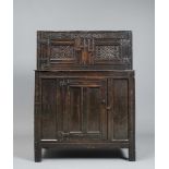 A JOINED OAK PANELLED PRESS CUPBOARD, North Lancashire/Westmorland, 17th century, the upper