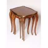 A NEST OF THREE LOUIS XV STYLE KINGWOOD TABLES of serpentine oblong form with parquetry panels and