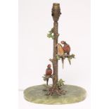 AN ART DECO ELECTRIC TABLE LAMP BASE, the cold painted cast bronze tree surmounted by a brace of