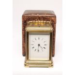 A GILDED BRASS CASED CARRIAGE CLOCK, c.1900, the twin barrel repeater movement regulated by a