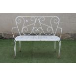 A FRENCH STYLE WIRE WORK SEAT, 20th century, the waisted open scroll work back with straight