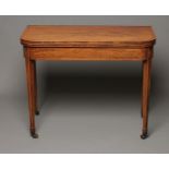 A GEORGIAN MAHOGANY FOLDING TEA TABLE, late 18th century, of rounded oblong form, with stringing,