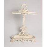 A VICTORIAN CAST IRON STICK STAND of oval outline, the waisted back moulded with foliage and with