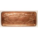 A NEWLYN ARTS AND CRAFTS COPPER TRAY of plain rounded oblong form, chased with four fish, seaweed