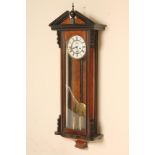 A VIENNA TYPE WALNUT WALL TIME PIECE, late 19th century, with ebony trim, with double weight