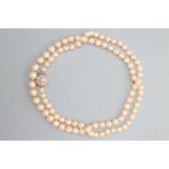 A CULTURED PEARL NECKLACE, the ninety one knotted and strung pearls to a diamond cluster clasp