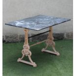 A GARDEN TABLE comprising a veined grey marble top on a Victorian cast iron base, the silhouette