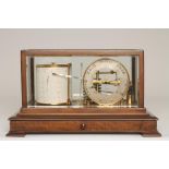 A MAHOGANY CASED BAROGRAPH retailed by Manoah Rhodes & Sons, Bradford, with silvered dial and