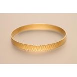 A MALTESE GOLD BANGLE, with diamond cutting, stamped G.18F., 20.4g (Est. plus 21% premium inc. VAT)