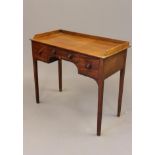 A MAHOGANY DRESSING TABLE, early 19th century, the moulded edged top with three quarter gallery,