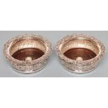 A PAIR OF EARLY VICTORIAN SILVER DECANTER COASTERS, maker Jn. Fry II, London 1837, the foliate