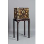 A CHINESE BLACK LACQUERED CABINET ON STAND, late 19th century, of oblong form with brass mounts