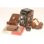 A ROLLEIFLEX "T" TWIN LENS CAMERA, in original stitched leather case with accessories including "