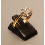 A SOLITAIRE DIAMOND RING, the round brilliant cut stone of approximately 0.7cts claw set to a