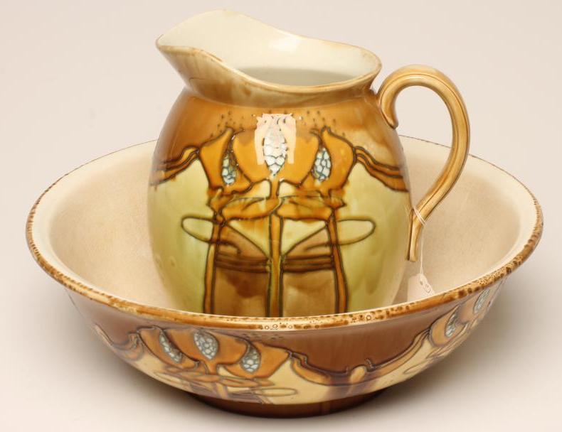 A MINTONS SECCESSIONIST TOILET JUG AND BOWL, c.1905, tubelined and painted in shades of mustard