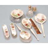 AN EIGHT PIECE SILVER DRESSING TABLE SET, Birmingham 1959/60/67, the white guilloche enamel