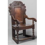 A YORKSHIRE JOINED OAK ARMCHAIR, mid/late 17th century and later, the plain panelled back with