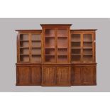 A VICTORIAN MAHOGANY LIBRARY BOOKCASE of breakfront form, the moulded cornice and plain frieze