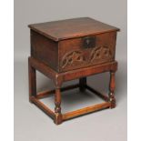AN OAK BOARDED BOX, early 18th century, the moulded two plank lid opening to a void interior, the