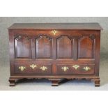 AN OAK PANELLED CHEST, mid/late 18th century, the moulded edged plank lid opening to interior with