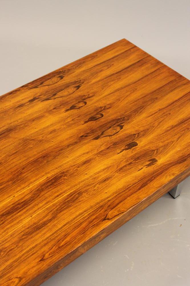 A GORDON RUSSELL ROSEWOOD VENEERED COFFEE TABLE, the plain oblong top raised on square section - Image 2 of 3