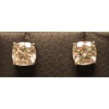 A PAIR OF STUD EARRINGS, the cushion cut moissanites totalling approximately 4.5cts, claw set to