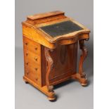 A VICTORIAN WALNUT DAVENPORT, the raised and waisted stationery compartment with hinged lid,