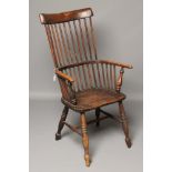 AN ASH AND ELM COMB BACK WINDSOR ARMCHAIR, early/mid 19th century, possibly Lincolnshire, plain stay