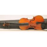 A VIOLIN with two piece back, ebony turners and notched sound holes, labelled "...