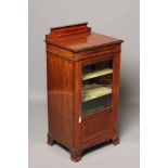 AN EDWARDIAN MAHOGANY AND SATINWOOD BANDED MUSIC CABINET, the moulded edged top with waisted ledge