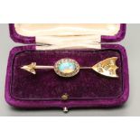A VICTORIAN OPAL AND DIAMOND ARROW BROOCH, the head set with two rose cut diamonds, the shield