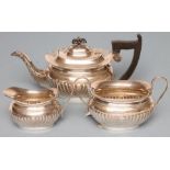 A COMPOSITE THREE PIECE SILVER TEA SERVICE, maker Viners, Sheffield 1931 (teapot) and 1933, of