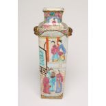 A CANTONESE PORCELAIN VASE of flared square section with gilded animal mask lug handles, painted