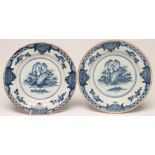 A PAIR OF DELFT PLATES, late 18th century, painted in blue with a pagoda, fence and rocks within a