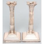 A PAIR OF SILVER CORINTHIAN COLUMN CANDLESTICKS, maker Henry Hobson & Sons, Sheffield 1915, the