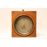 A BRASS CASED ANEROID BAROMETER by Negretti & Zambra, London, the silvered dial with semi-circular