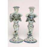 A PAIR OF CANTAGALLI MAIOLICA CANDLESTICKS, late 19th century, the armour clad winged grotesques