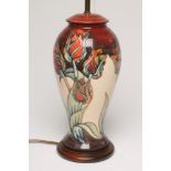A MOORCROFT POTTERY TABLE LAMP BASE, modern, of inverted baluster form tubelined and painted with