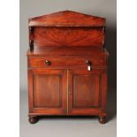 A MAHOGANY AND BANDED CHIFFONIER, early 19th century, the raised arched back with shelf on