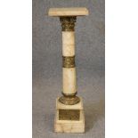 A VEINED WHITE ONYX AND GILT METAL PEDESTAL, late 19th/20th century, the square stand on turned