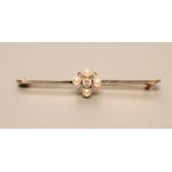 A LATE VICTORIAN BAR BROOCH centred by a diamond and cultured pearl cross panel, stamped 15ct, 2"
