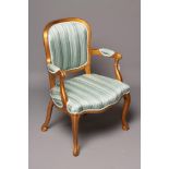 A LOUIS XV STYLE PAINTED GILT WOOD FAUTEUIL, 19th century, upholstered in pale green striped silk,