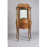 A LOUIS XV STYLE VITRINE, 20th century, of splayed serpentine form with gilt metal mounts and